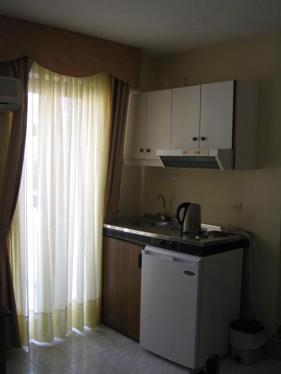 Odyssey Hotel Apartments Kárpatos Habitación foto
